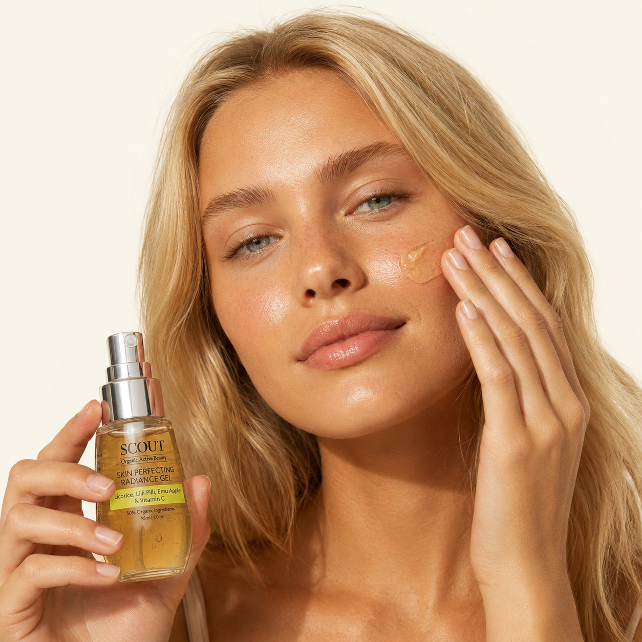 Woman applying skincare product with a bottle labeled 'SCOUT' on a beige background