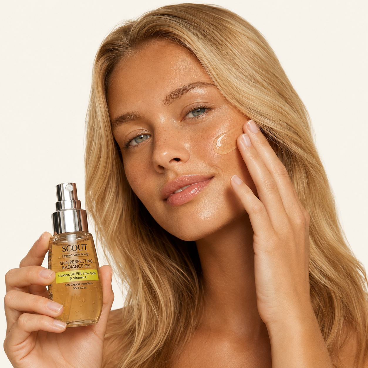 Woman applying skincare product to her face with a bottle of 'Scout' serum.