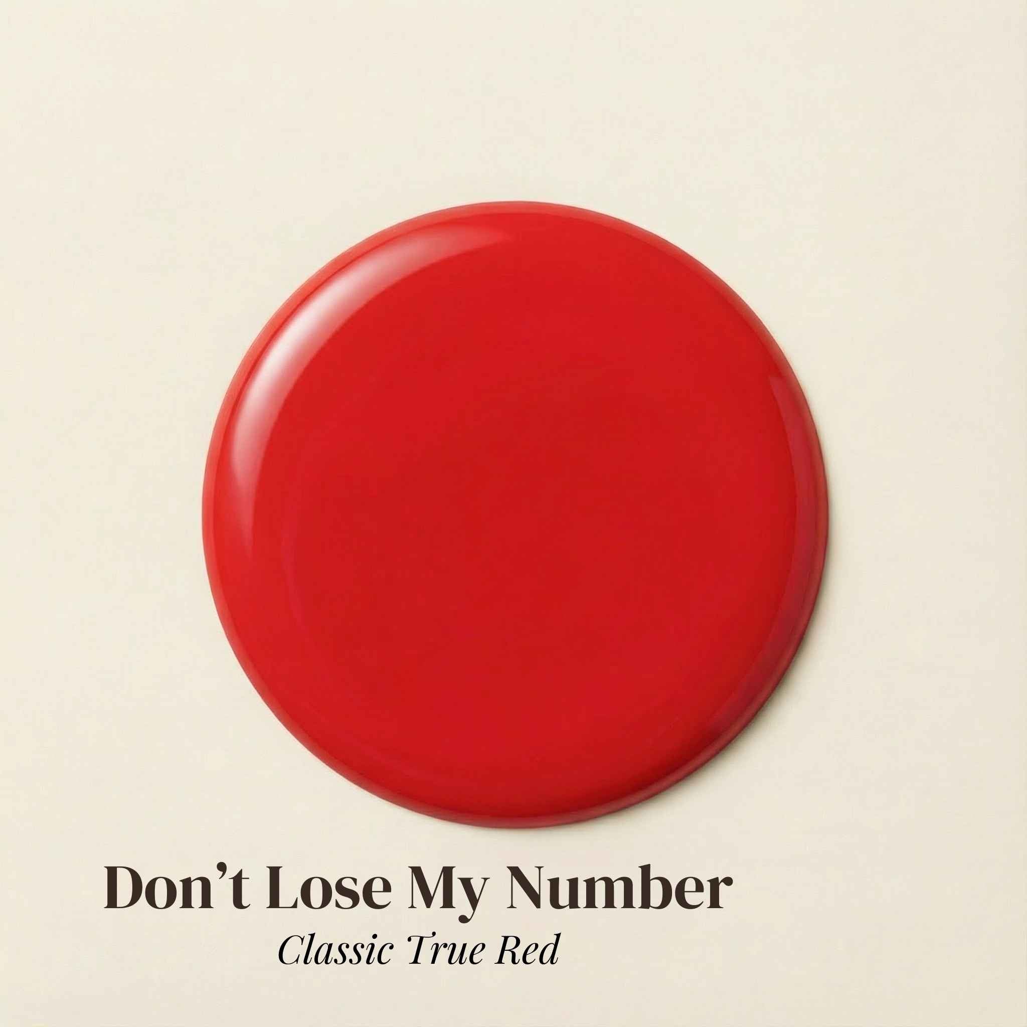 Red circular object on a beige background with text 'Don't Lose My Number Classic True Red'.