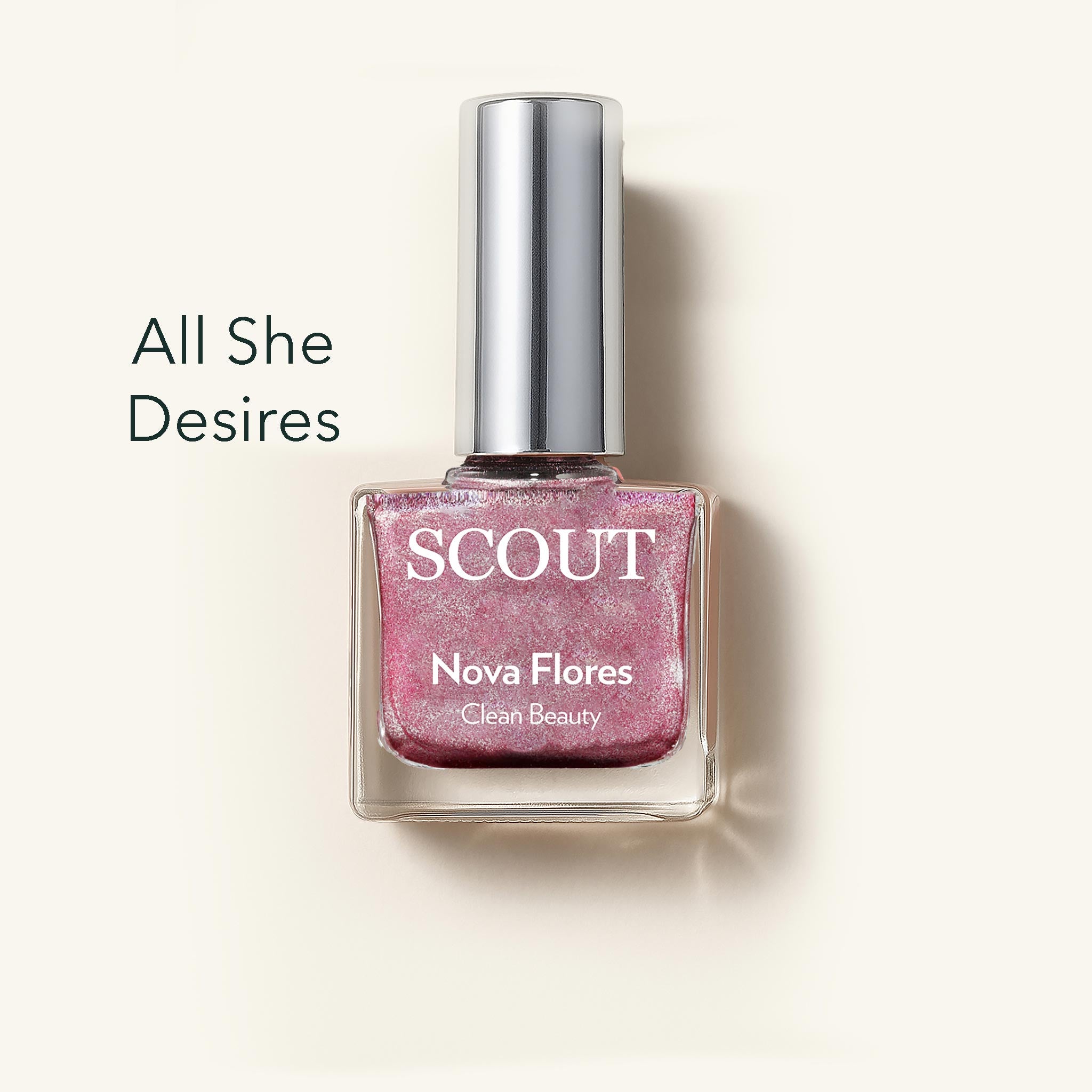 SCOUT nail polish bottle with pink glittery polish on a light beige background