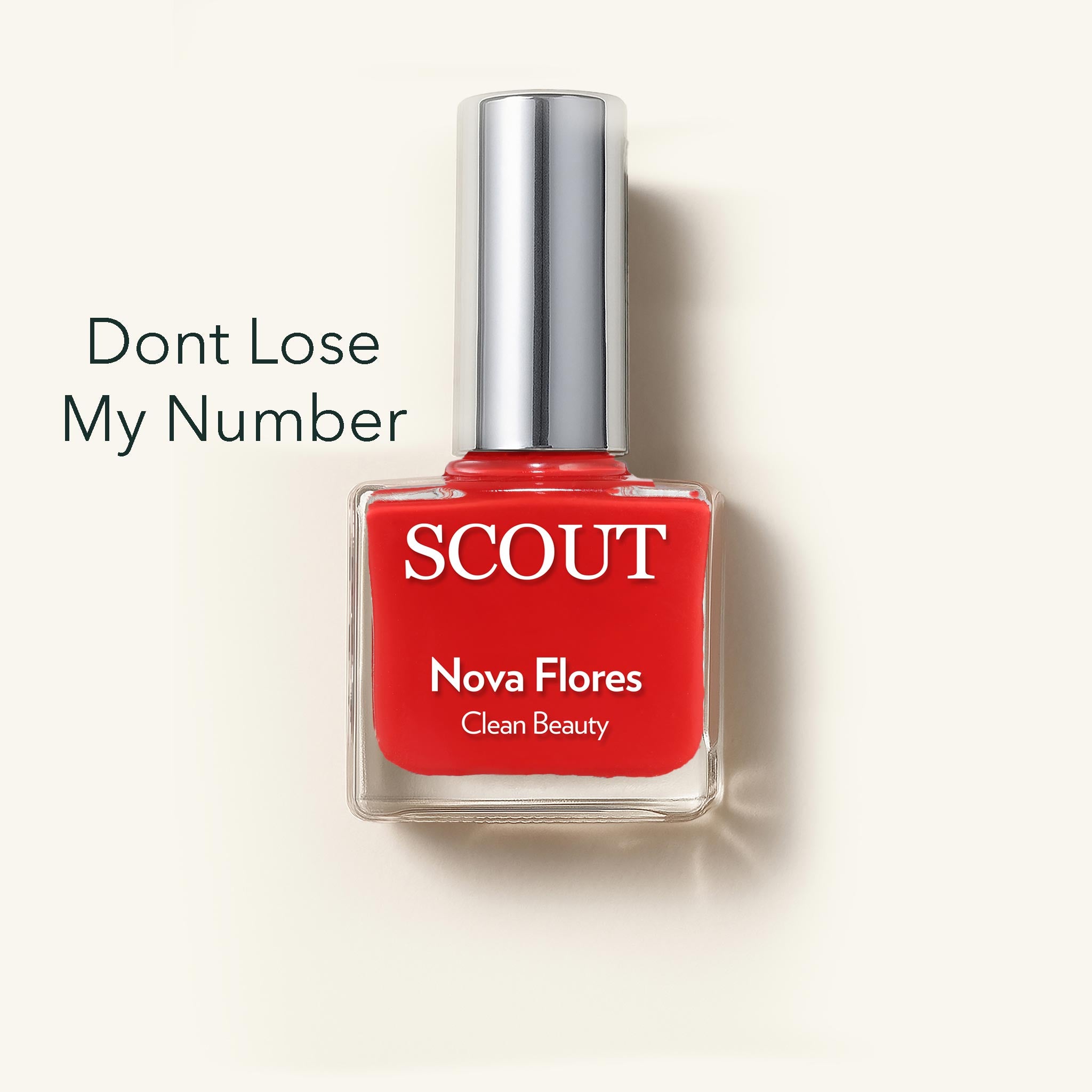 Red nail polish bottle with silver cap on a white background, featuring the brand 'SCOUT'.