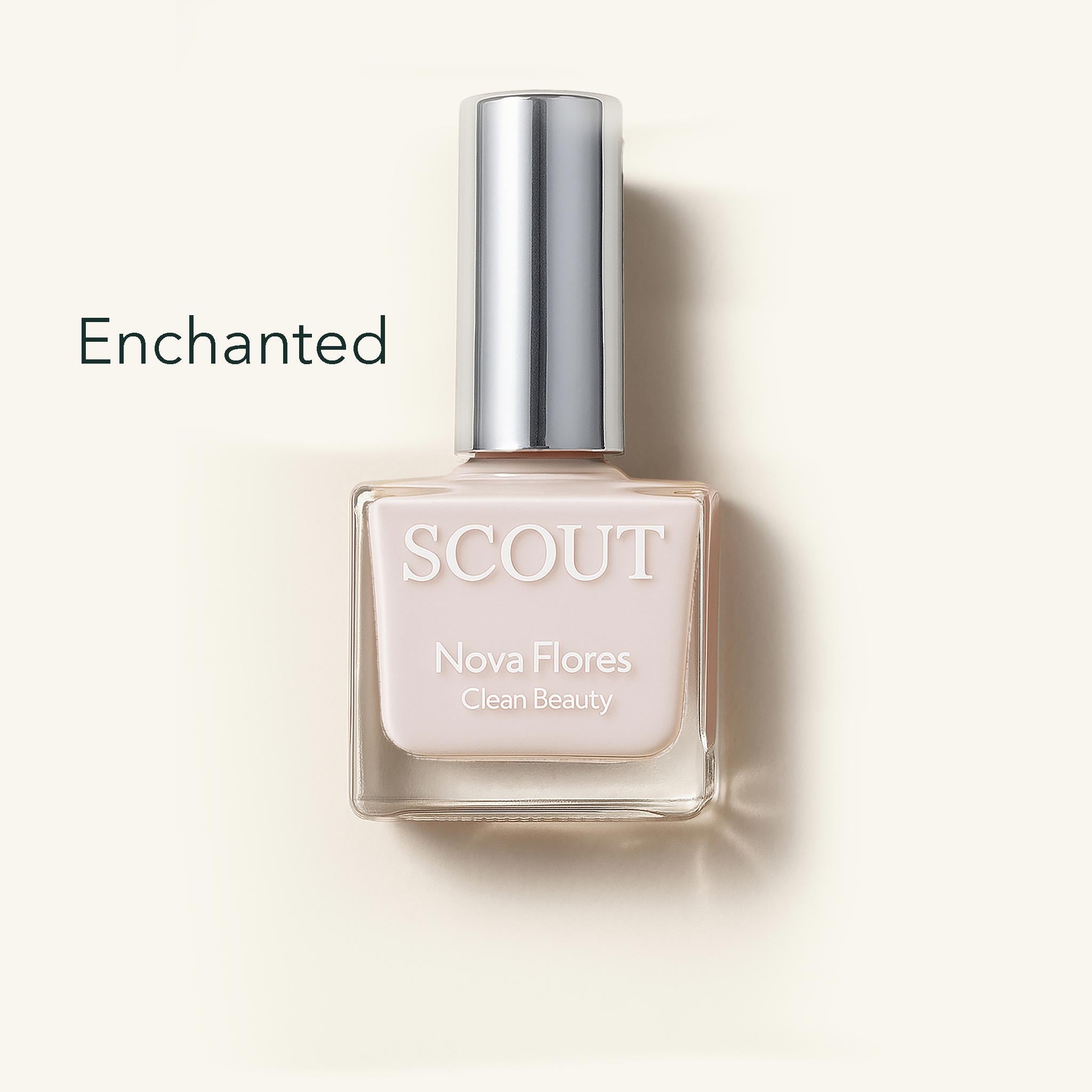 SCOUT nail polish bottle labeled 'Enchanted' on a light beige background