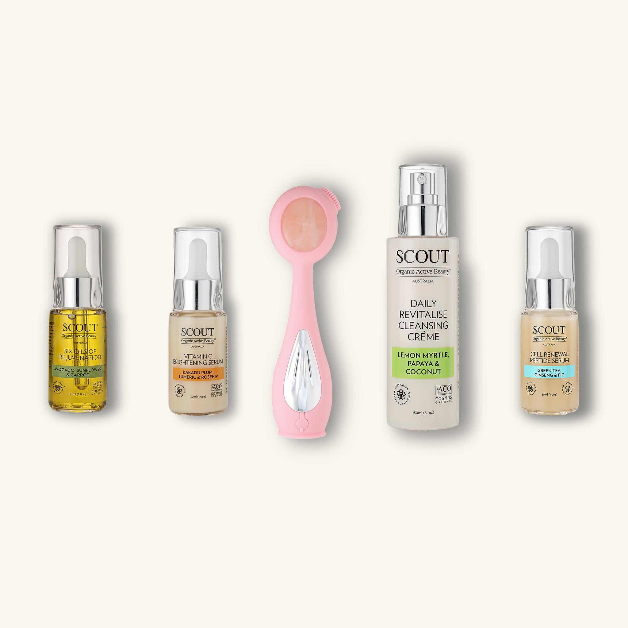 A collection of skincare products including a cleansing crème, a skin therapy glow system device, a peptide serum, a brightening serum, and a rejuvenation oil, all labelled 'SCOUT'.