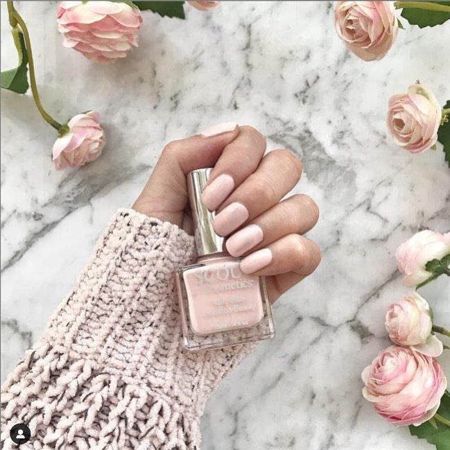 Womans hand holding a bottle of SCOUT Balmoral Calling Summer Pastels Nail Polish