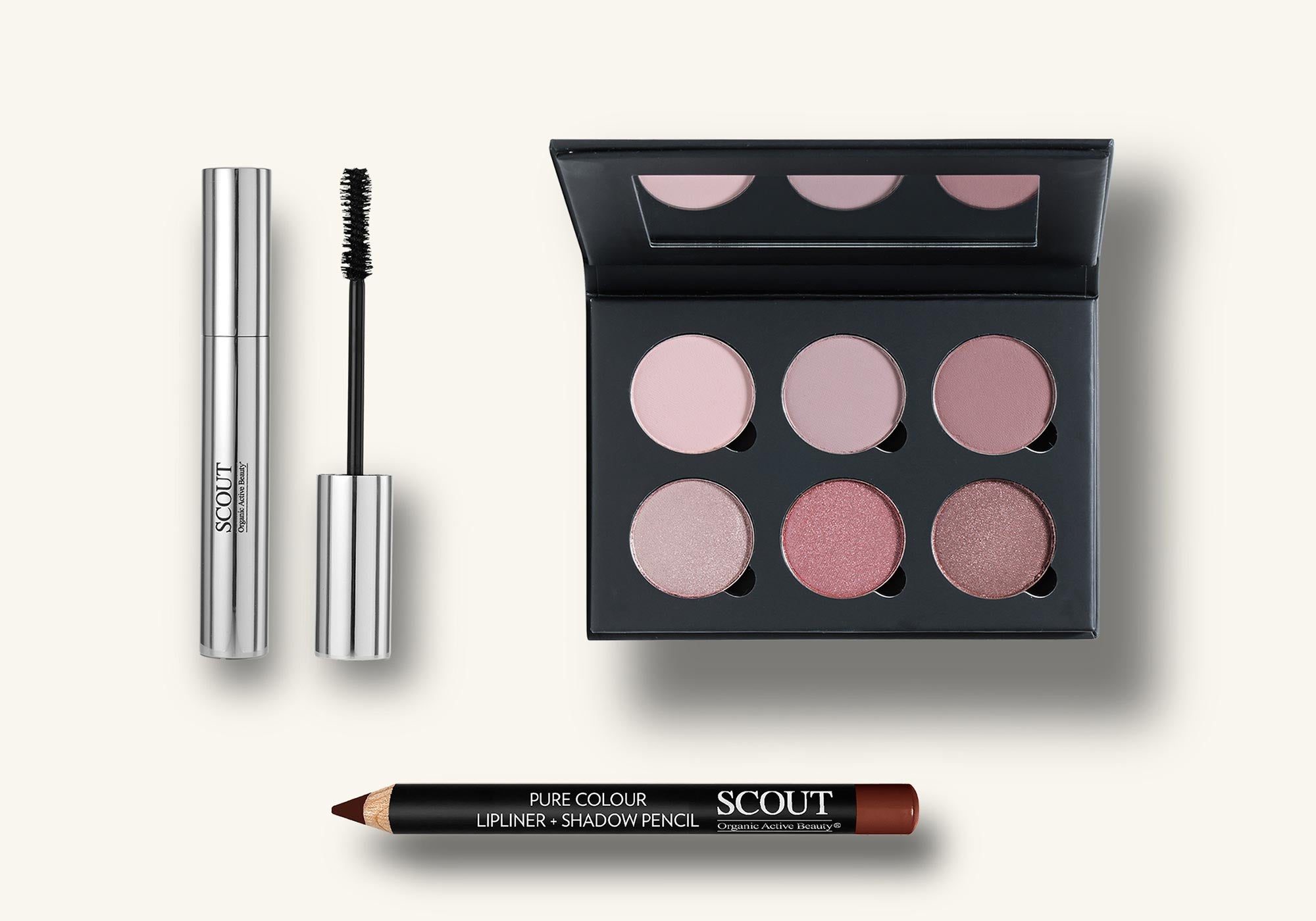 Makeup products including a mascara, eyeliner, and a shadow palette with pink shades on a white background.