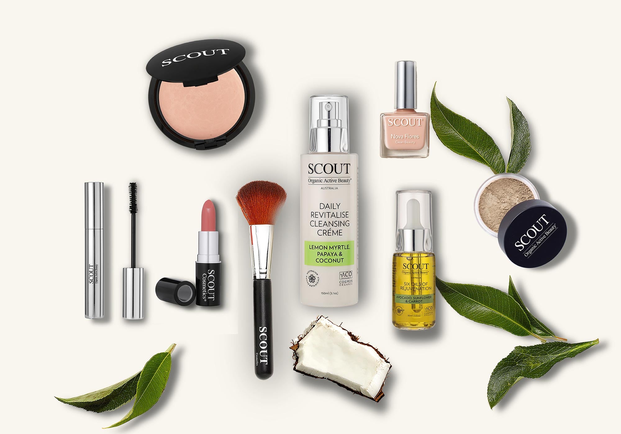 Scout skincare and makeup products with green leaves on a white background