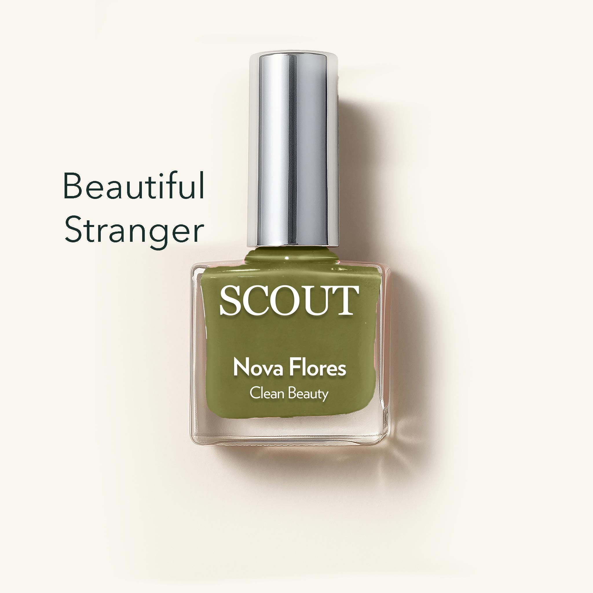 Green nail polish bottle with 'SCOUT' branding on a light beige background
