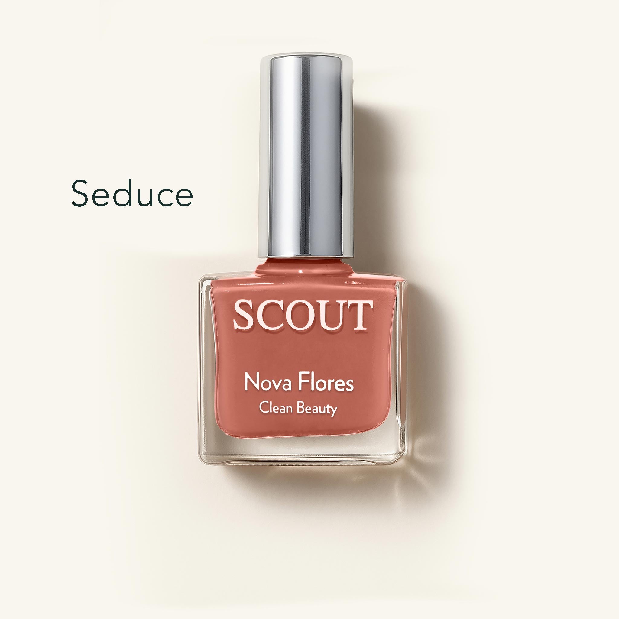 SCOUT nail polish bottle labeled 'Seduce' on a beige background