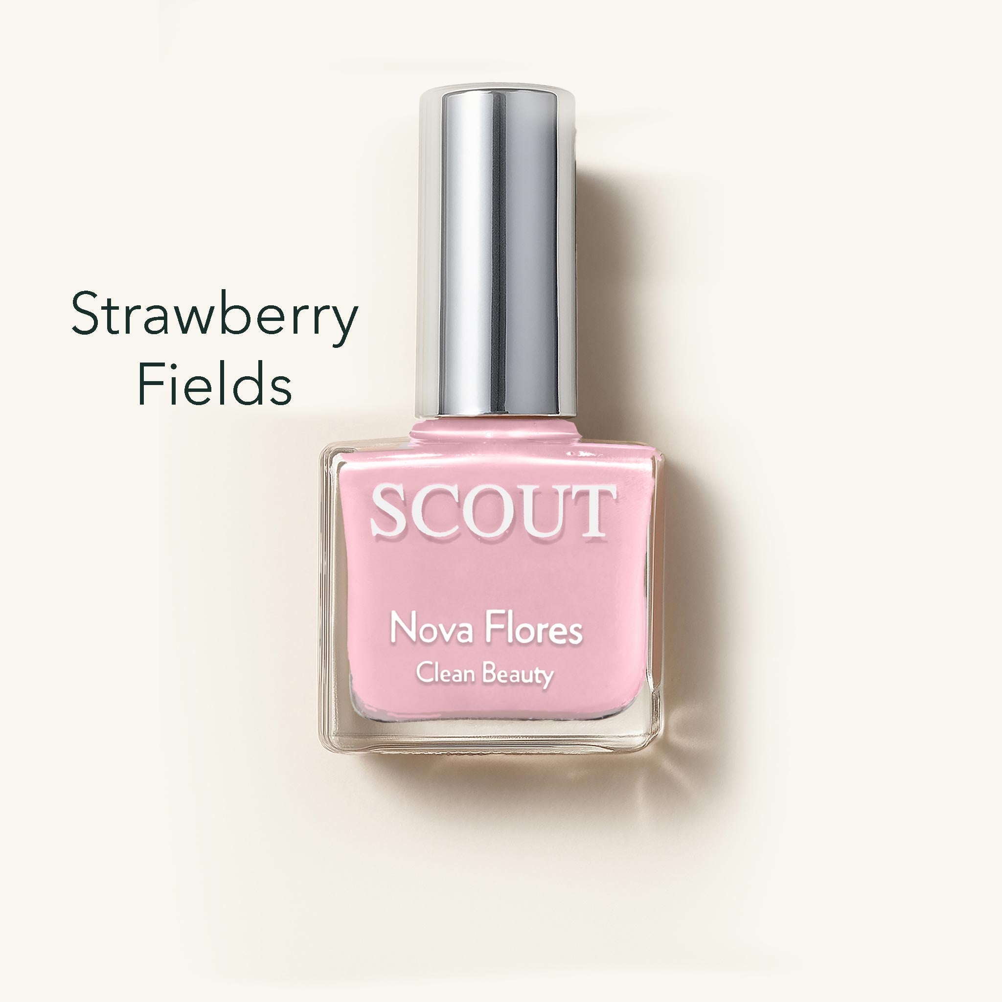 Pink nail polish bottle labeled 'Strawberry Fields' by Scout on a light beige background