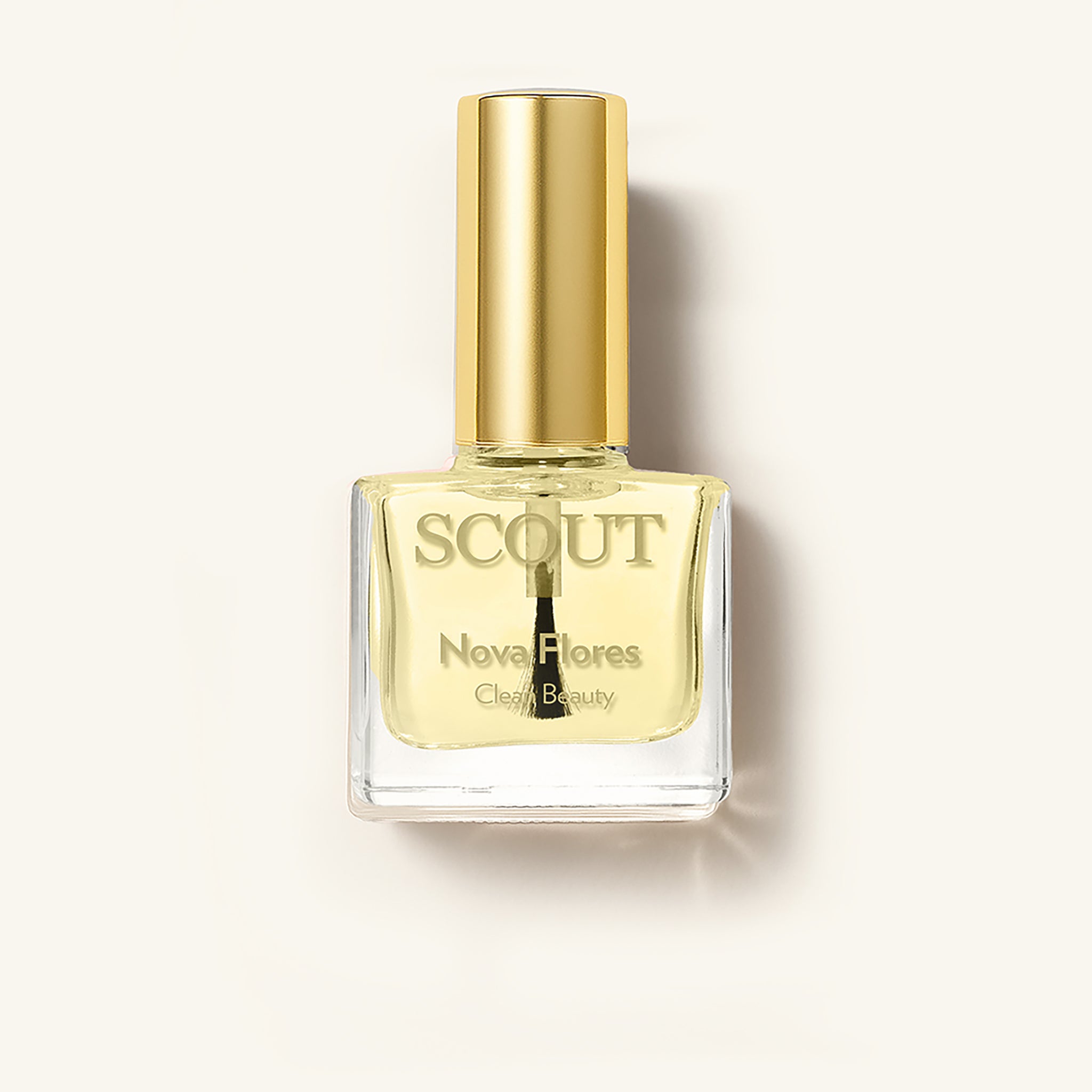 SCOUT cuticle oil with gold cap and visible brush, photographed on soft bone background; clean beauty product for natural nail care from Australian skincare brand