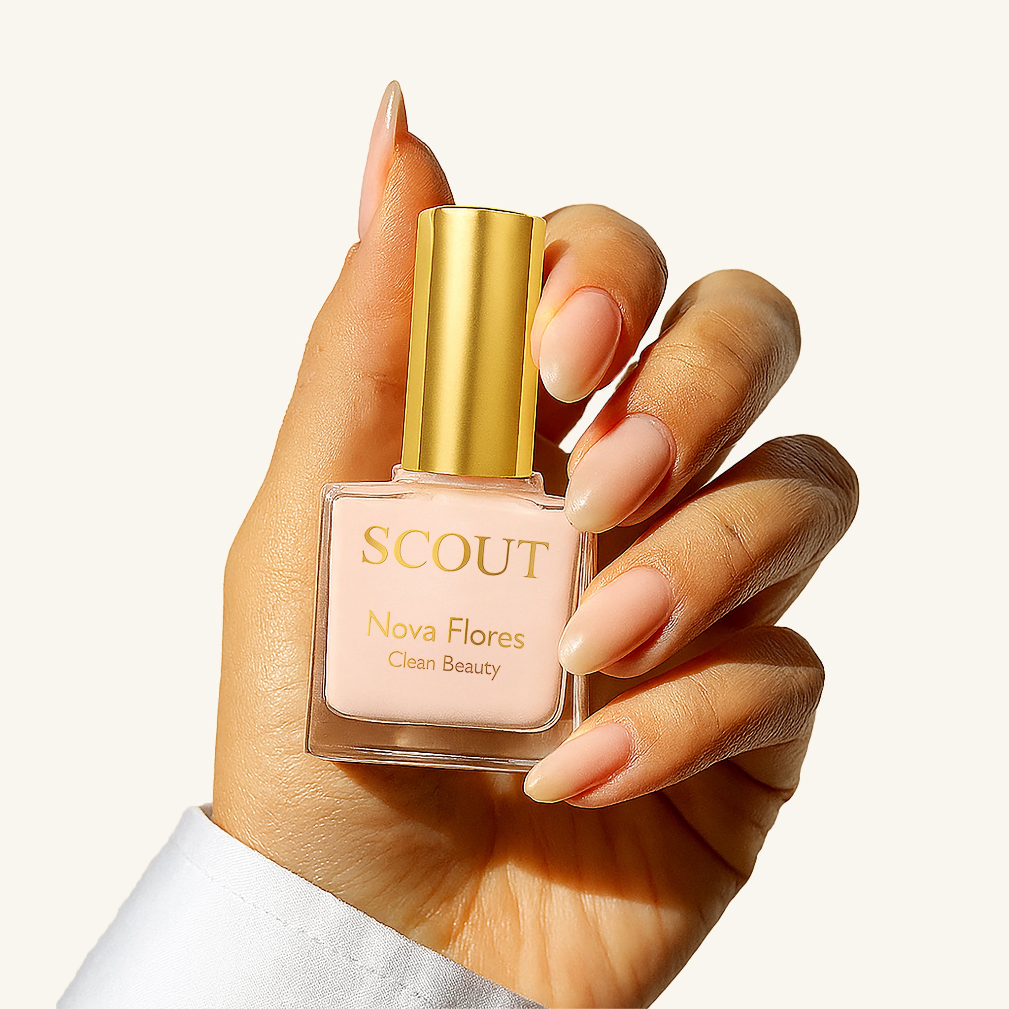 Hand holding SCOUT Ridge Filler nail treatment bottle, showcasing natural nail care from Australian clean beauty brand for smoother, healthier-looking nails